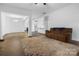 Spacious living room with hardwood floors, neutral walls, and an open layout, creating a versatile and inviting space at 7186 Barleywood Dr, Locust, NC 28097