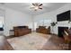Comfortable living room features a cozy fireplace and neutral tones at 7186 Barleywood Dr, Locust, NC 28097