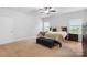 Well-lit bedroom features a comfortable king bed and neutral color palette at 7186 Barleywood Dr, Locust, NC 28097