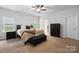 Spacious bedroom with neutral-toned walls and a dark-wood dresser at 7186 Barleywood Dr, Locust, NC 28097