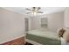 Cozy bedroom with a ceiling fan, window, and a comfortable bed with an olive green coverlet at 775 Bolick Rd, Fort Mill, SC 29707