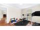 Bright workout room with a window, weight-lifting bench, and a treadmill on wood floors at 775 Bolick Rd, Fort Mill, SC 29707