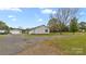 Charming single-story home with gravel driveway, detached garage, and spacious lawn at 775 Bolick Rd, Fort Mill, SC 29707