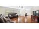 Spacious living room featuring hardwood floors, comfortable seating, and a seamless flow to other living spaces at 775 Bolick Rd, Fort Mill, SC 29707