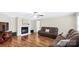Comfortable living room with a fireplace, hardwood floors, and a warm, inviting atmosphere at 775 Bolick Rd, Fort Mill, SC 29707
