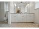 Bathroom featuring a long vanity with lots of cabinet storage, and patterned flooring at 819 Old Dutch W Rd, Indian Trail, NC 28079