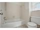 Bathroom featuring a tub/shower, a toilet, and white tile at 819 Old Dutch W Rd, Indian Trail, NC 28079