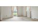 Well-lit room with neutral carpet and two windows, ideal for creating a peaceful and inviting bedroom space at 819 Old Dutch W Rd, Indian Trail, NC 28079