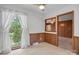 Cozy dining area with large window and wood-paneled accent walls at 819 Old Dutch W Rd, Indian Trail, NC 28079