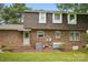 Rear exterior view of a brick house with a well-maintained lawn at 819 Old Dutch W Rd, Indian Trail, NC 28079