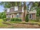 Beautiful brick home with manicured shrubs, and blue shutters, showcasing classic design elements and curb appeal at 819 Old Dutch W Rd, Indian Trail, NC 28079