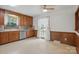 Inviting kitchen with wood cabinets, stainless steel dishwasher, and bright window at 819 Old Dutch W Rd, Indian Trail, NC 28079