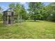 View of the yard with a wooden play structure and mature trees at 819 Old Dutch W Rd, Indian Trail, NC 28079