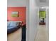 Long hallway featuring views of the bedroom and green dining area at 8605 Ducksbill Dr, Charlotte, NC 28277