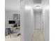 Bright hallway leading to an office space with dual monitors and natural light at 8605 Ducksbill Dr, Charlotte, NC 28277