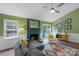 Bright living room with fireplace, hardwood floors, and access to back yard at 8605 Ducksbill Dr, Charlotte, NC 28277