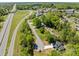 Aerial view showcasing the home's location near roadways and among a mix of trees and residences at 869 Kathryn Se Dr, Concord, NC 28025