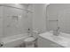 This bathroom boasts a shower over tub with tiled walls and a modern vanity at 869 Kathryn Se Dr, Concord, NC 28025