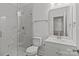 Bathroom featuring marble tile in the shower, vanity, and commode at 869 Kathryn Se Dr, Concord, NC 28025