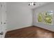 Bedroom featuring wood flooring, neutral paint, and a bright window with outside view at 869 Kathryn Se Dr, Concord, NC 28025