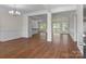 Spacious living room features hardwood floors, large windows with natural light, and decorative trim at 869 Kathryn Se Dr, Concord, NC 28025