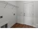 Mud room features coat rack, door to outside, and wood flooring at 869 Kathryn Se Dr, Concord, NC 28025