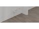 This image showcases the plumbing and baseboard molding in the living room space at 869 Kathryn Se Dr, Concord, NC 28025