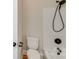 Bathroom features a shower-tub combination with dark fixtures and a white toilet at 1000 Potters Bluff Rd, Monroe, NC 28110