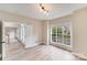 Bedroom with light wood flooring and bright natural light from a large window at 1000 Potters Bluff Rd, Monroe, NC 28110