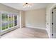 Bedroom with light wood flooring and bright natural light from a large window at 1000 Potters Bluff Rd, Monroe, NC 28110