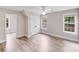 Bright bedroom featuring double door closet and two windows at 1000 Potters Bluff Rd, Monroe, NC 28110