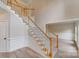 Elegant foyer featuring a staircase with carpeted treads and a view into the adjacent dining space at 1000 Potters Bluff Rd, Monroe, NC 28110