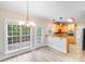 Eat-in kitchen with granite counters, view of deck, and stainless appliances at 1000 Potters Bluff Rd, Monroe, NC 28110
