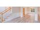 Bright living room boasts hardwood floors, staircase, and classic trim work at 1000 Potters Bluff Rd, Monroe, NC 28110