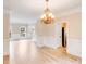 Open-plan living and dining room boasting hardwood floors and stylish lighting at 1000 Potters Bluff Rd, Monroe, NC 28110