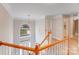 Traditional staircase with an arched window allowing natural light at 1000 Potters Bluff Rd, Monroe, NC 28110