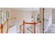 Traditional wood staircase with white painted balusters and arched window at 1000 Potters Bluff Rd, Monroe, NC 28110