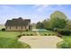 Spacious backyard featuring in ground pool, patio, grass, and mature trees at 1012 Harper Lee Dr, Newton, NC 28658