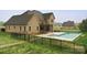 Spacious backyard featuring an in ground pool and large trees at 1012 Harper Lee Dr, Newton, NC 28658