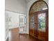 Inviting foyer with decorative double doors and rich wood flooring leading to additional rooms at 1012 Harper Lee Dr, Newton, NC 28658