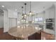 Modern kitchen with stainless steel appliances, granite countertops, and a decorative backsplash at 1012 Harper Lee Dr, Newton, NC 28658