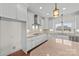 Bright kitchen featuring white cabinets, stainless steel appliances, and a stylish backsplash at 1012 Harper Lee Dr, Newton, NC 28658