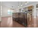 Kitchen island with stone accents, dark wood, and ample cabinet space at 1012 Harper Lee Dr, Newton, NC 28658