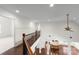 Open-concept living area with hardwood floors, high ceilings, and elegant architectural details at 1012 Harper Lee Dr, Newton, NC 28658