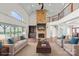 Bright, spacious living room with stone fireplace, large windows, and open floor plan at 1012 Harper Lee Dr, Newton, NC 28658