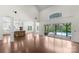 Spacious living room with a view of the pool, showcasing an open layout and natural light at 1012 Harper Lee Dr, Newton, NC 28658