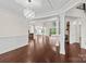 Spacious living room with large windows, stone fireplace, and an open concept design at 1012 Harper Lee Dr, Newton, NC 28658