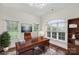 Bright, home office with custom desk, large windows, and elegant decor at 1012 Harper Lee Dr, Newton, NC 28658