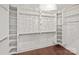 Spacious walk-in closet with custom shelving and hanging rods for optimal storage and organization at 1012 Harper Lee Dr, Newton, NC 28658