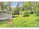 A charming backyard shed is visible from the screened-in back porch at 10432 Camelback Cir, Charlotte, NC 28226